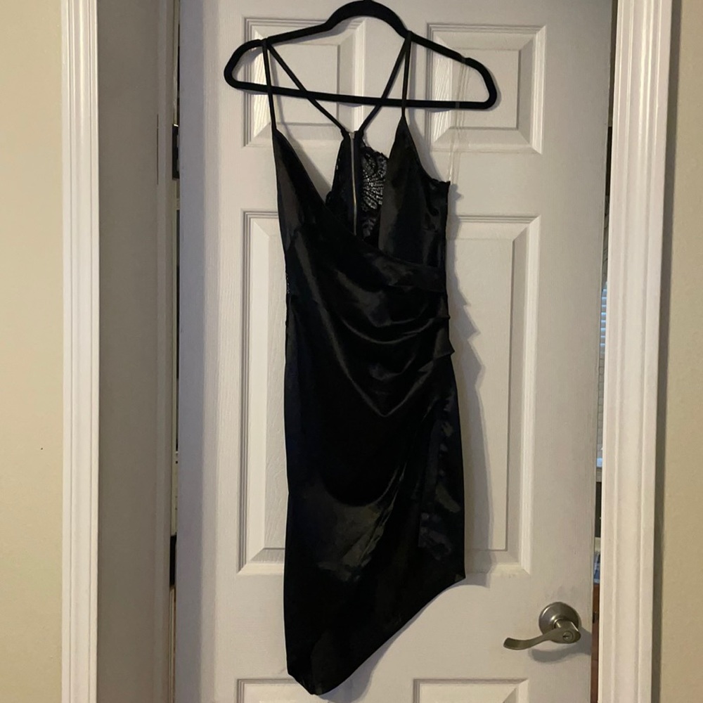 Never worn silk black dress. Spaghetti straps to a low v-neck with a lace back